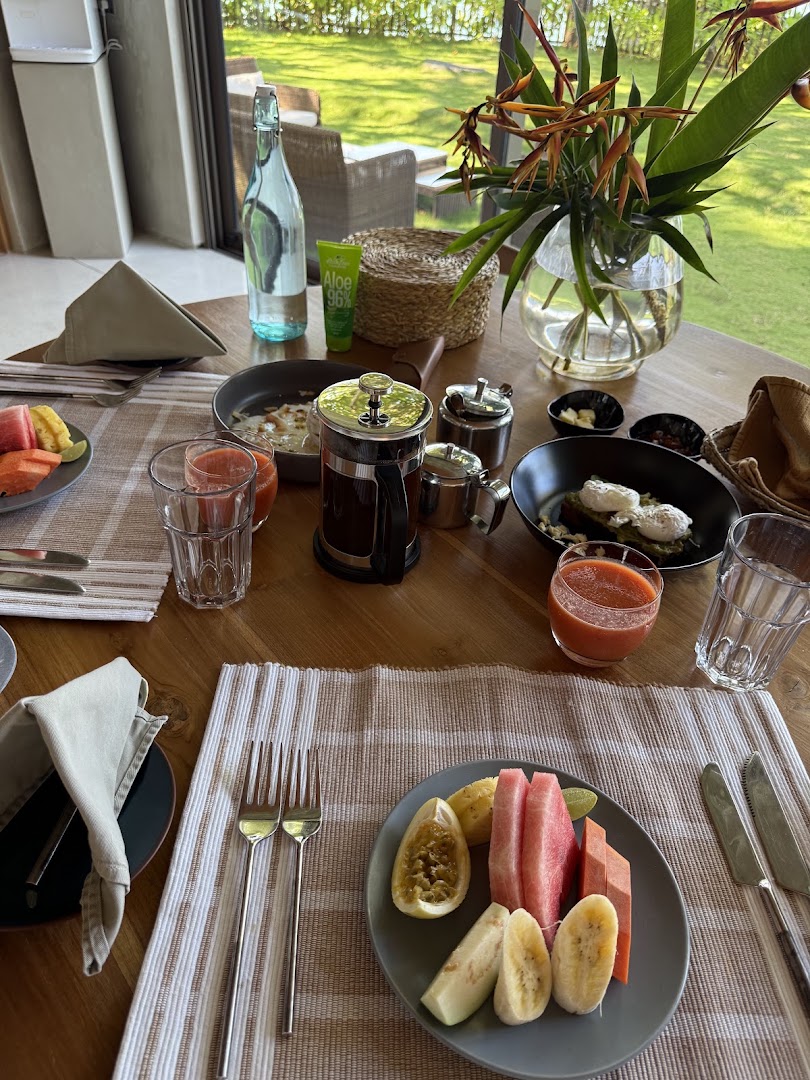 Breakfast table with fruit, juice, and coffee